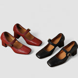 Red and black orthopedic Mary Jane heeled shoes with buckle strap