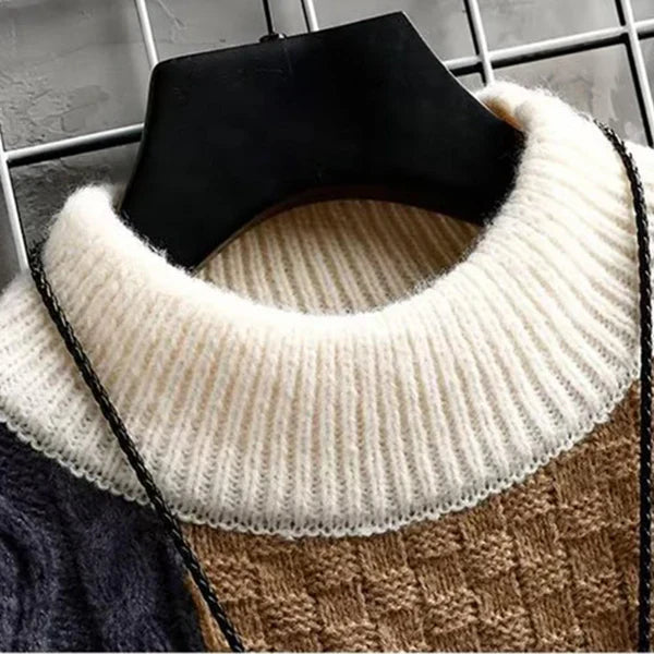Patchwork knit pullover with ribbed cream turtleneck and black neckline trim