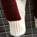 Patchwork knit sleeve with burgundy and cream sections, ribbed cuff and hem