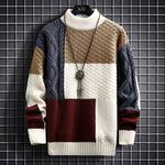 Patchwork knit pullover with cream, navy, and burgundy color blocks and ribbed cuffs