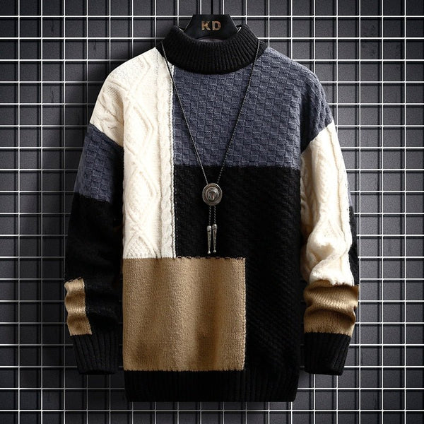 Patchwork knit pullover with black yoke, cream sleeves, and tan chest panel