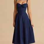 Navy midi dress with spaghetti straps, ruched sweetheart neckline, gathered waist, sleeveless