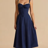 Navy midi dress with spaghetti straps, ruched sweetheart neckline, gathered waist, sleeveless