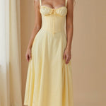 Yellow midi dress with spaghetti straps and ruched bodice, gathered waist, sleeveless