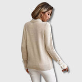 Back view of beige crewneck lace-trim pullover with long sleeves