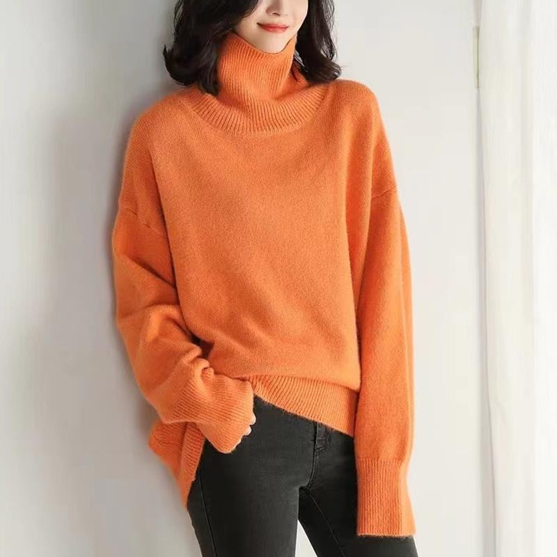 Orange long-sleeve turtleneck knit pullover with ribbed cuffs