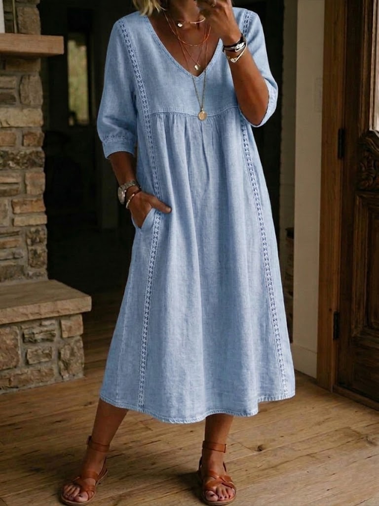 Antonia A-line maxi dress in light blue, V-neck, 3/4 sleeves, gathered skirt.