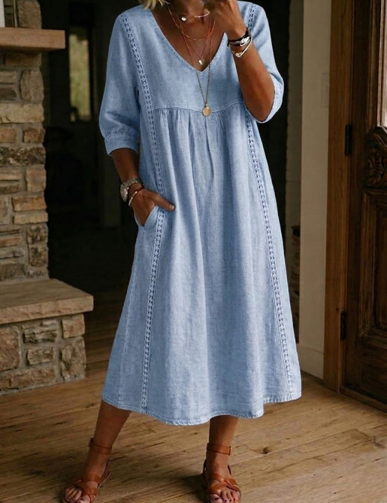 Antonia A-line maxi dress in light blue, V-neck, 3/4 sleeves, gathered skirt.
