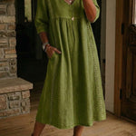 Antonia A-line maxi dress in olive green, V-neck, 3/4 sleeves, gathered waist.