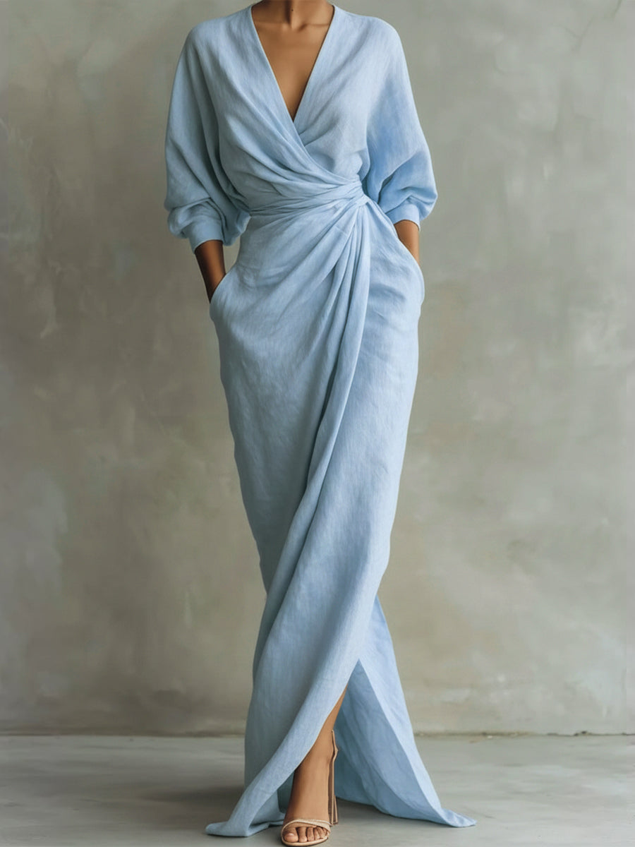 Light blue wrap maxi dress with V-neck, gathered waist and long puff sleeves