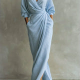 Light blue wrap maxi dress with V-neck, gathered waist and long puff sleeves