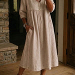 Antonia A-line maxi dress in sand, V-neck, 3/4 sleeves, gathered skirt.
