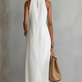 White sleeveless midi dress viewed from back, with Mao collar detail