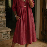 Antonia A-line maxi dress in burgundy, V-neck, 3/4 sleeves, gathered skirt.