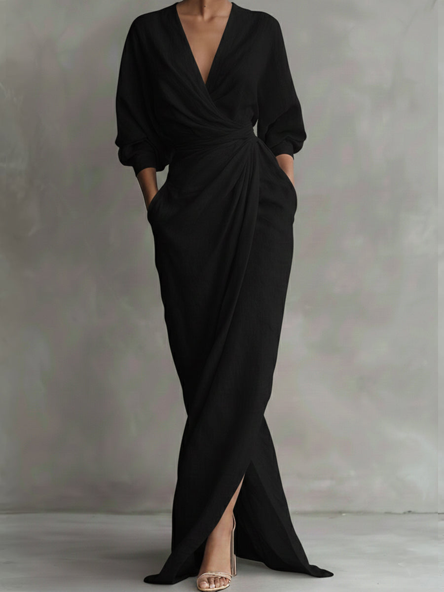Black wrap maxi dress with V-neck, gathered waist and long puff sleeves
