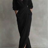 Black wrap maxi dress with V-neck, gathered waist and long puff sleeves