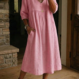 Antonia A-line maxi dress in blush pink, V-neck, 3/4 sleeves, gathered skirt.
