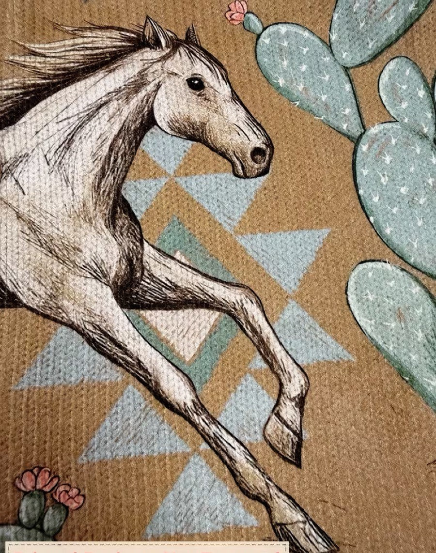 Horse graphic on women's knit jacket, tan background with blue cactus shapes.