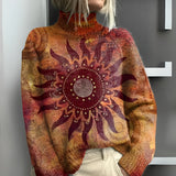 Warm knitted roll-neck sweater with large tribal sun motif, rust orange knit