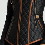 Black quilted padded jacket detail with front zipper pocket and tan contrast trim