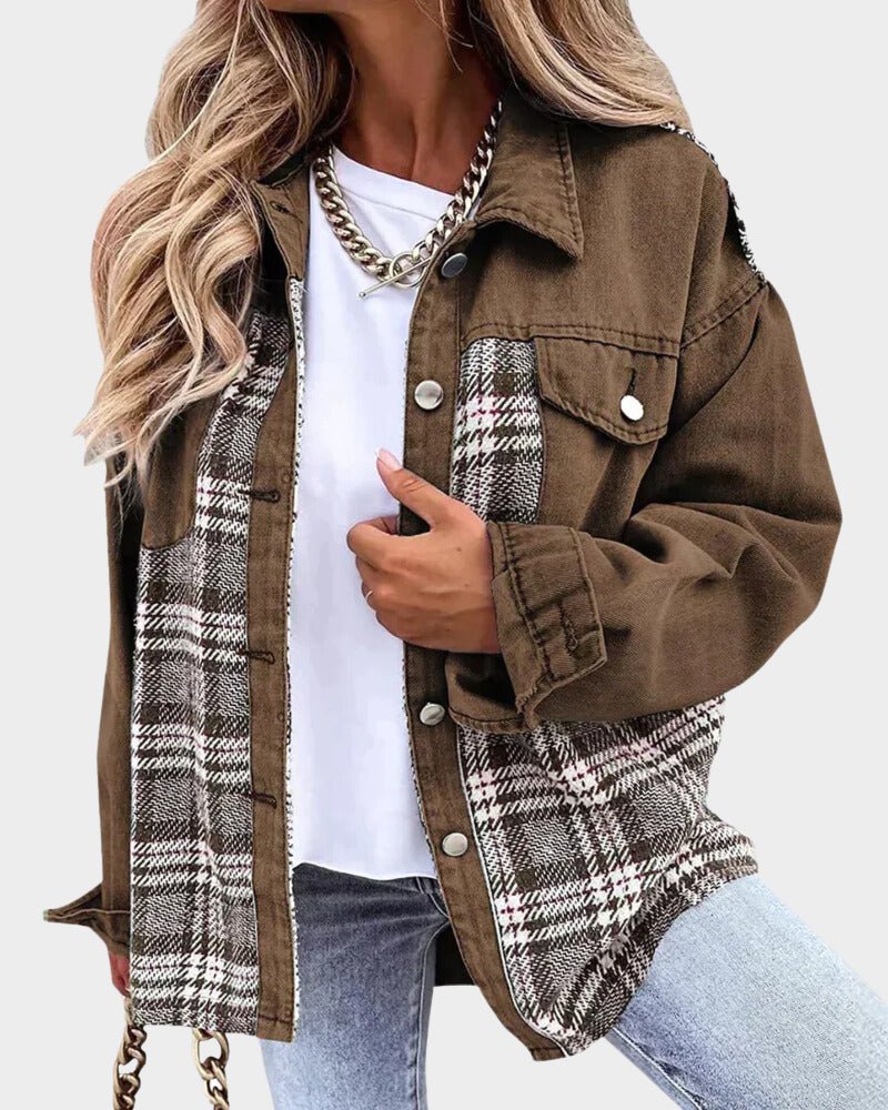 Brown denim jacket with plaid lining, button front, and chest flap pockets