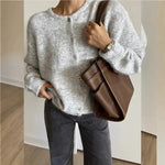 Light gray long-sleeve knit cardigan with round neck and button front