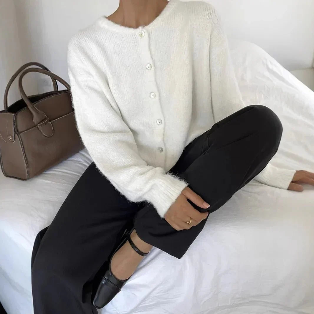 White long-sleeve button cardigan with crew neckline and ribbed cuffs