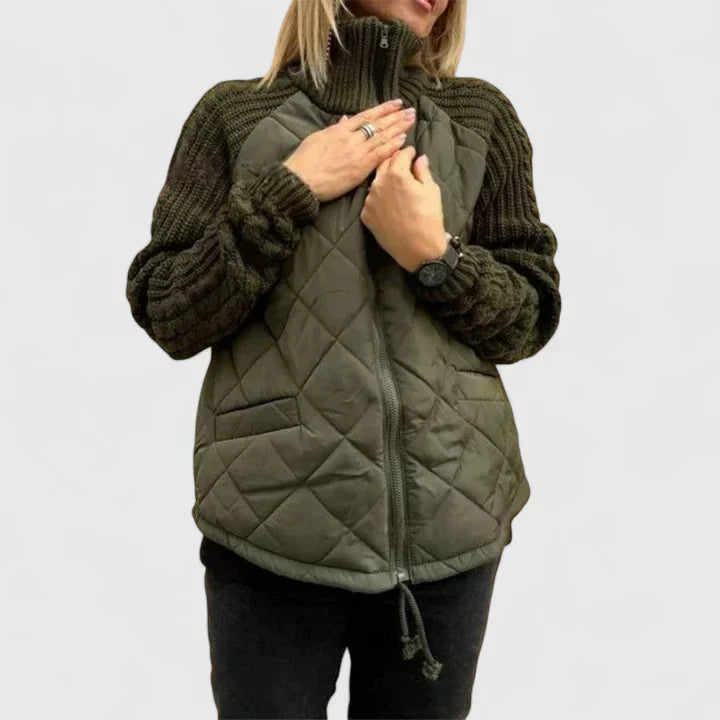 Olive green quilted jacket with zip front and ribbed knit sleeves