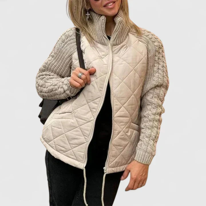 Beige quilted jacket with zip front and ribbed knit sleeves