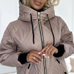 Light pink quilted hooded jacket close-up with full zipper and drawstring hood cords