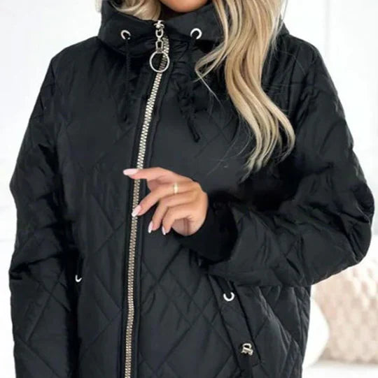 Black quilted hooded jacket showing front zipper and ring pull with drawstring hood cords