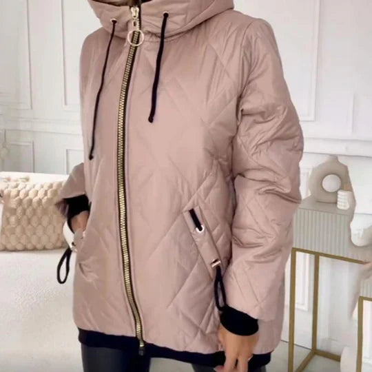 Light pink quilted hooded jacket with gold ring zip pull, front zipper and pocket detail