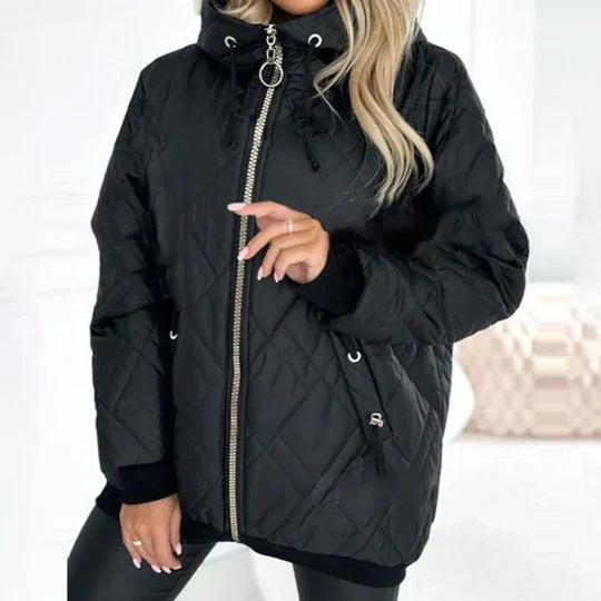 Black quilted puffer jacket with hood, front zip, ring pull, and drawstring sleeve cuffs