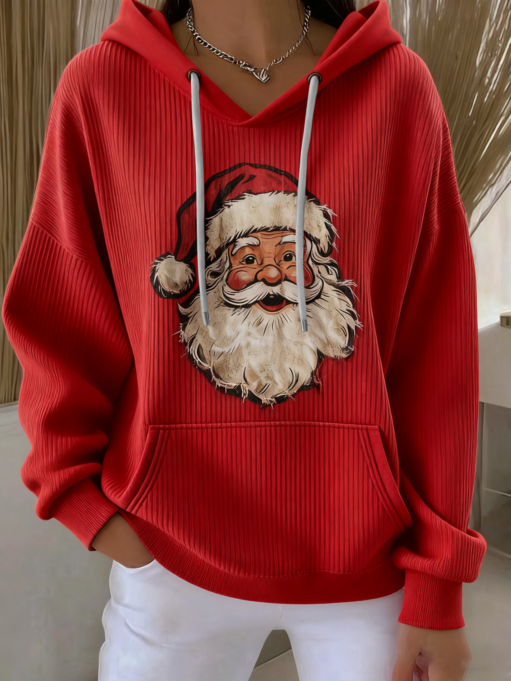 Red Santa Claus graphic pullover hoodie with hood, drawstrings, and front pouch pocket.