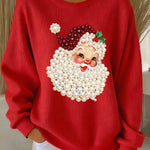 Red women’s crewneck sweatshirt with pearl Santa face print and long sleeves
