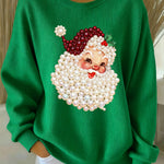 Green women’s crewneck sweatshirt with pearl Santa face print and long sleeves