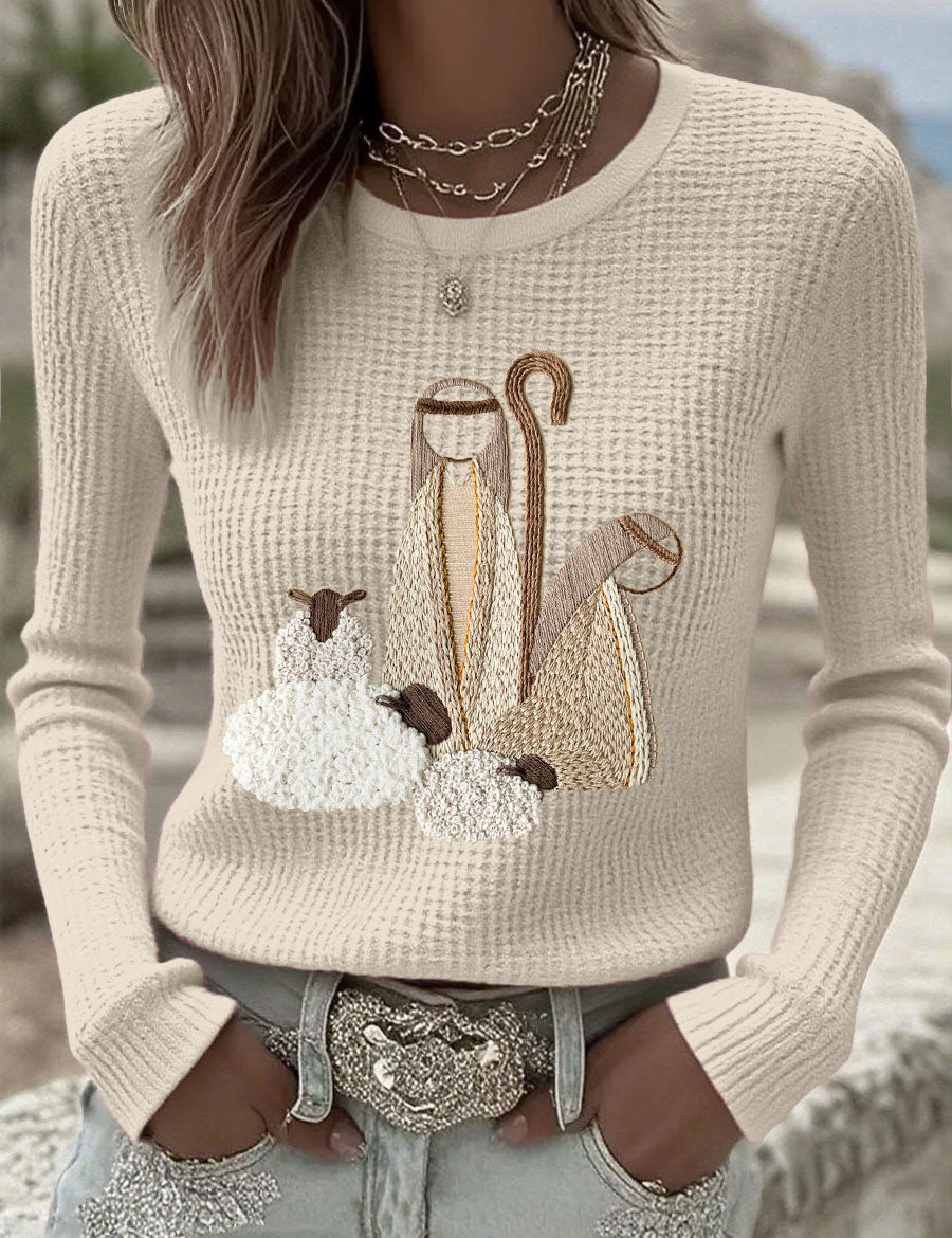 Women’s knit top with nativity scene applique, long sleeves, crew neck, off-white