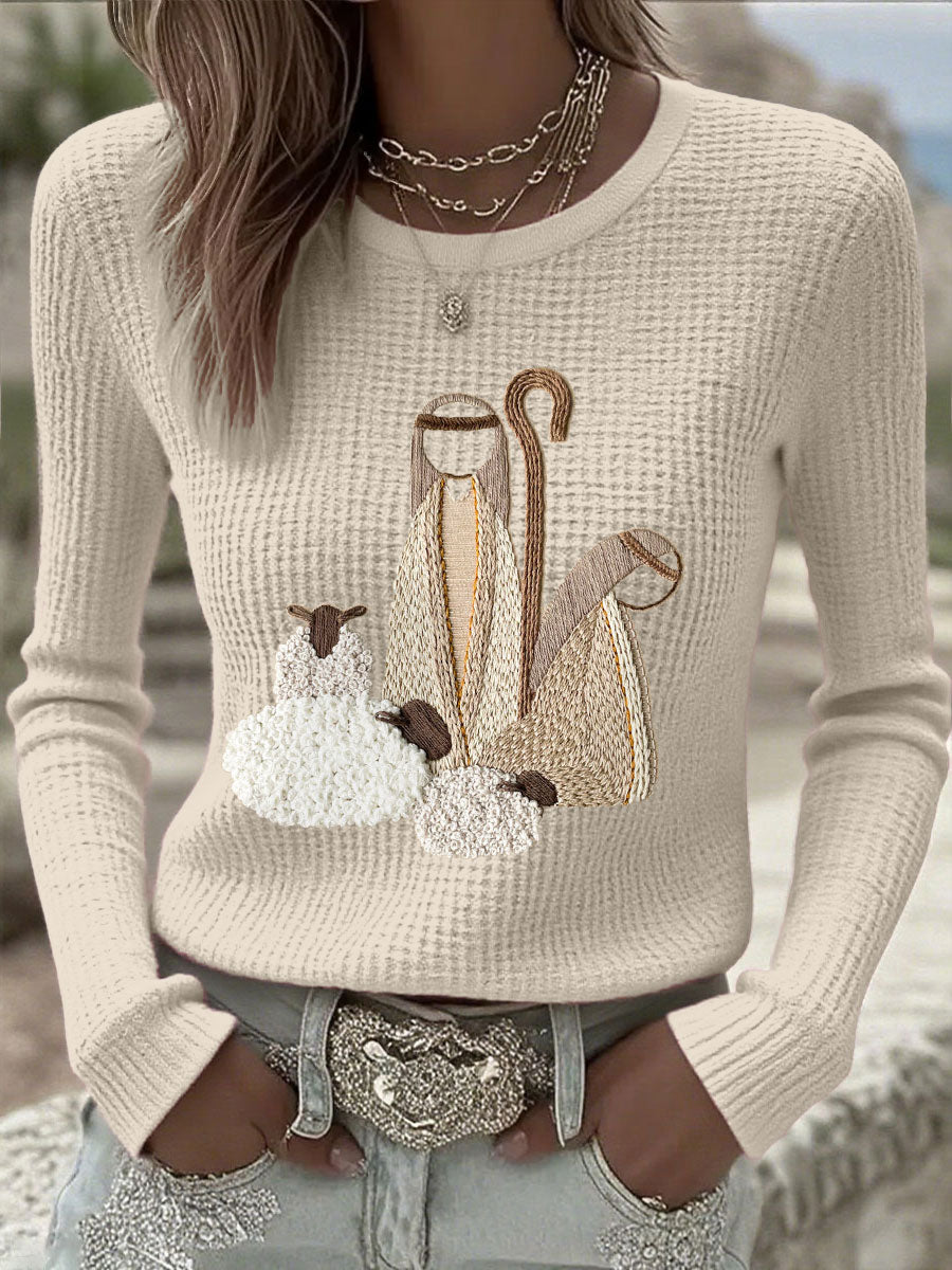 Women’s knit top with nativity scene applique, long sleeves, crew neck, off-white