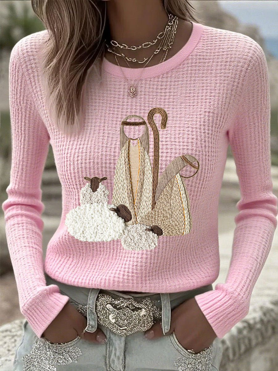 Women’s knit top with nativity scene applique, long sleeves, crew neck, light pink