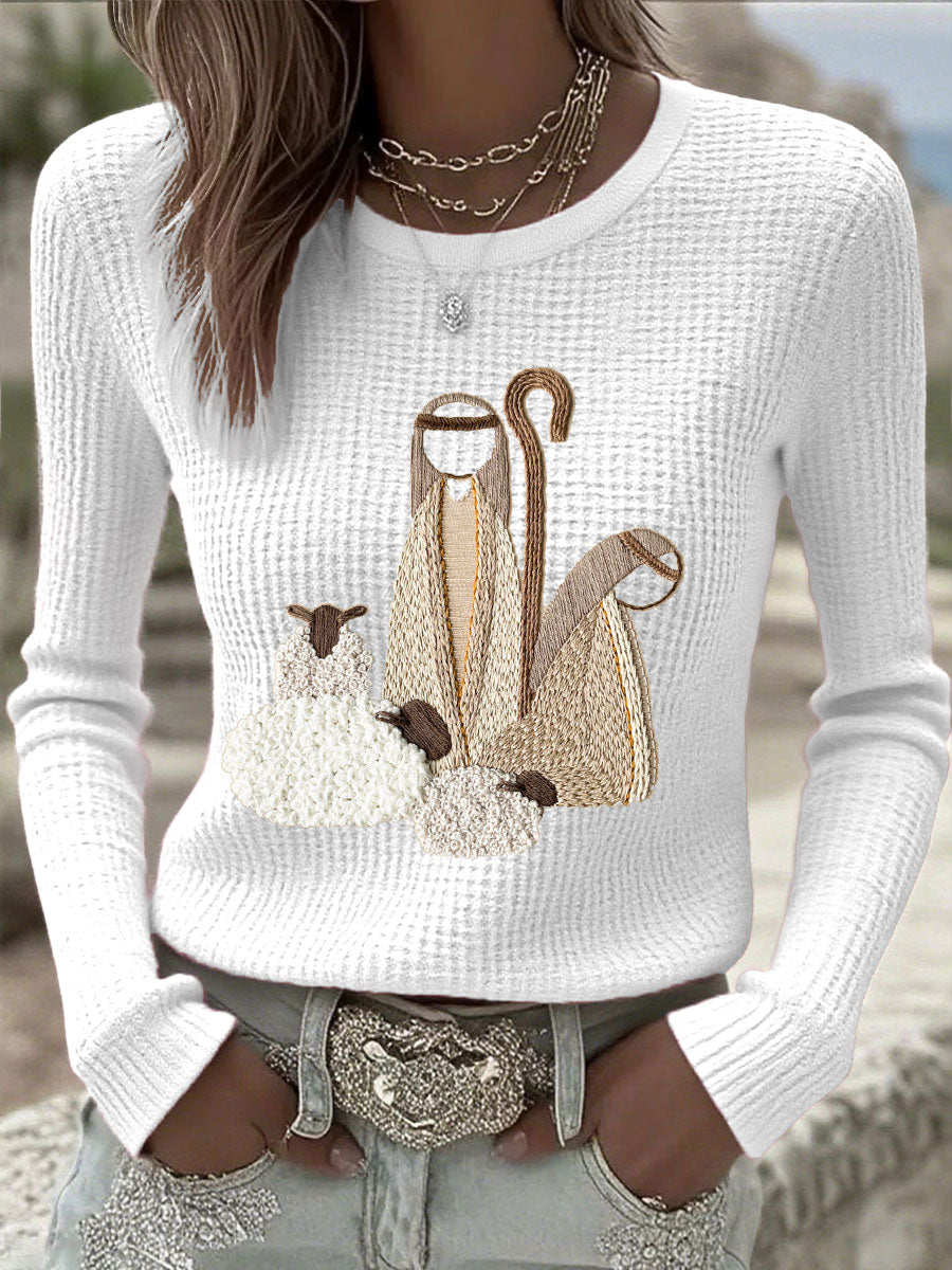 Women’s knit top with nativity scene applique, long sleeves, crew neck, off-white