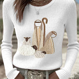 Women’s knit top with nativity scene applique, long sleeves, crew neck, off-white