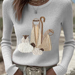 Women’s knit top with nativity scene applique, long sleeves, crew neck, beige-white