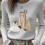 Women’s knit top with nativity scene applique, long sleeves, crew neck, beige-white