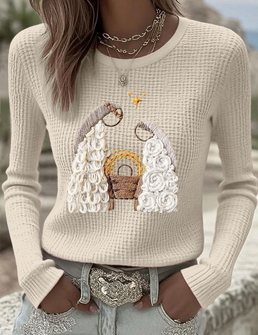 Beige waffle-knit long-sleeve sweater with nativity scene graphic