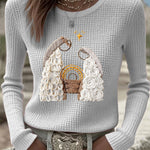 Women's light gray waffle-knit long-sleeve top with nativity graphic