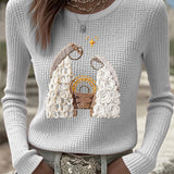 Women's light gray waffle-knit long-sleeve top with nativity graphic