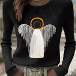 Black knit sweater with angel nativity graphic and wing detail, long sleeves