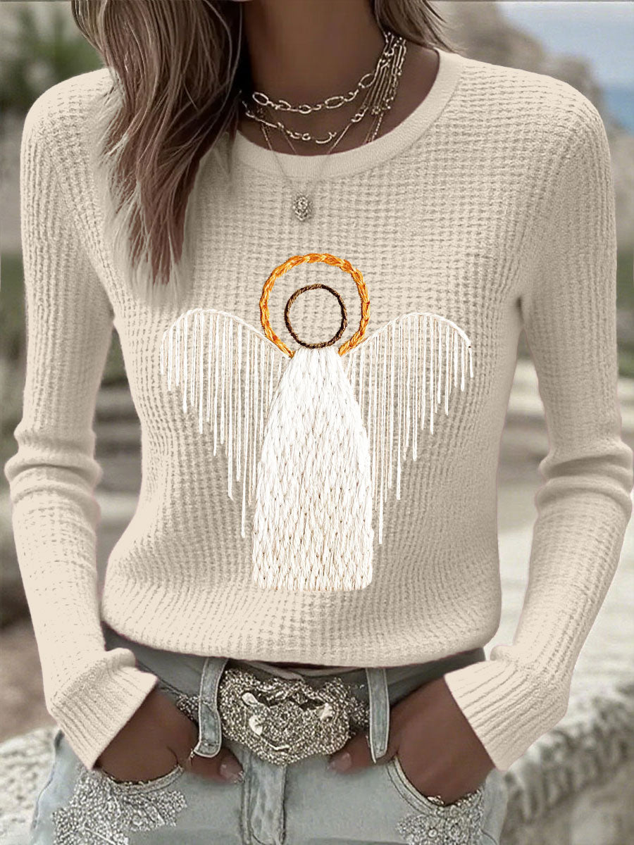 Beige knit sweater with angel nativity graphic, long sleeves