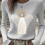Light gray knit sweater with angel nativity graphic, long sleeves