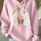 Pink ribbed women’s hoodie with embroidered nativity scene and drawstring hood